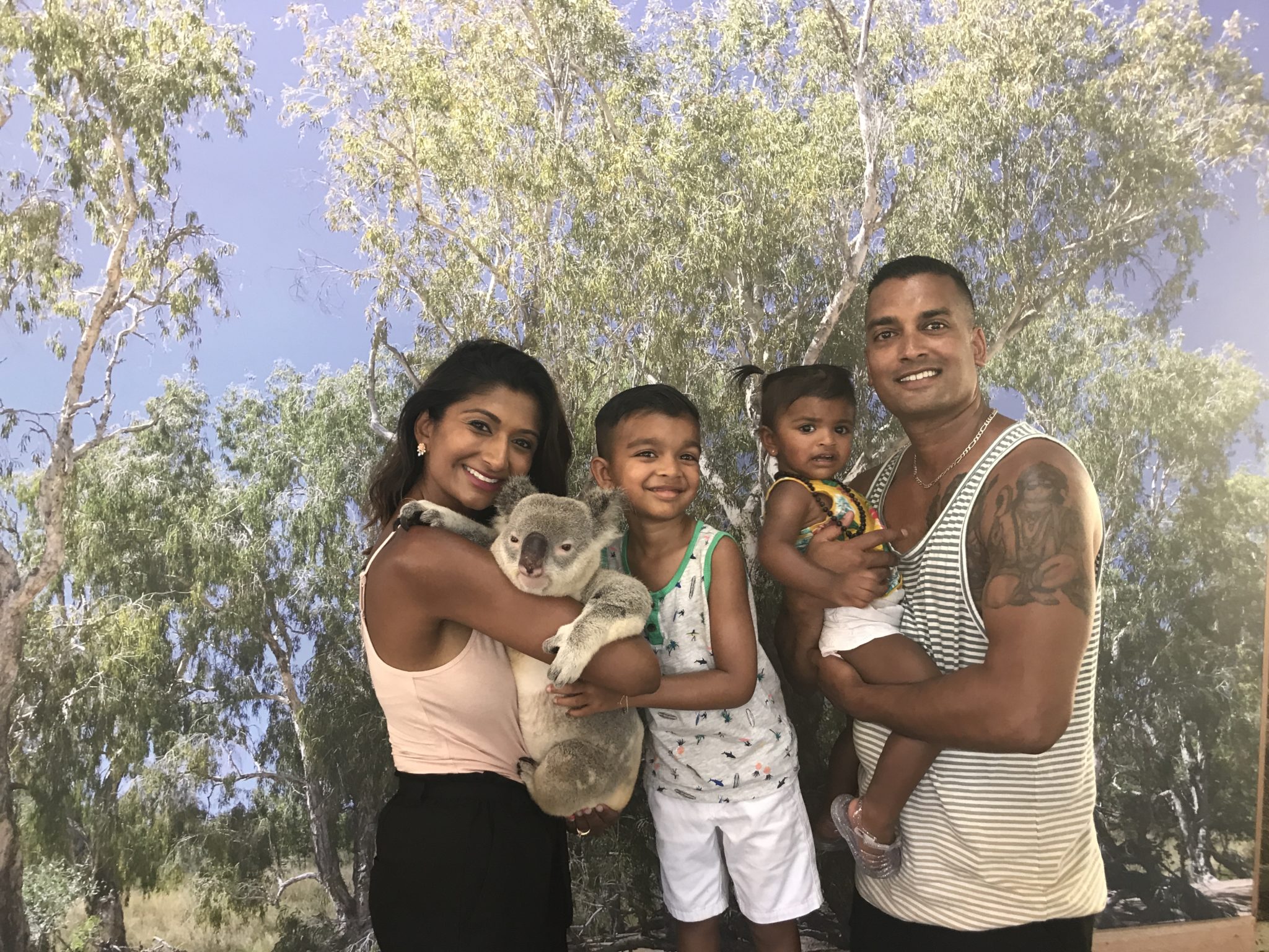 Family-holding-Koala-Kuranda